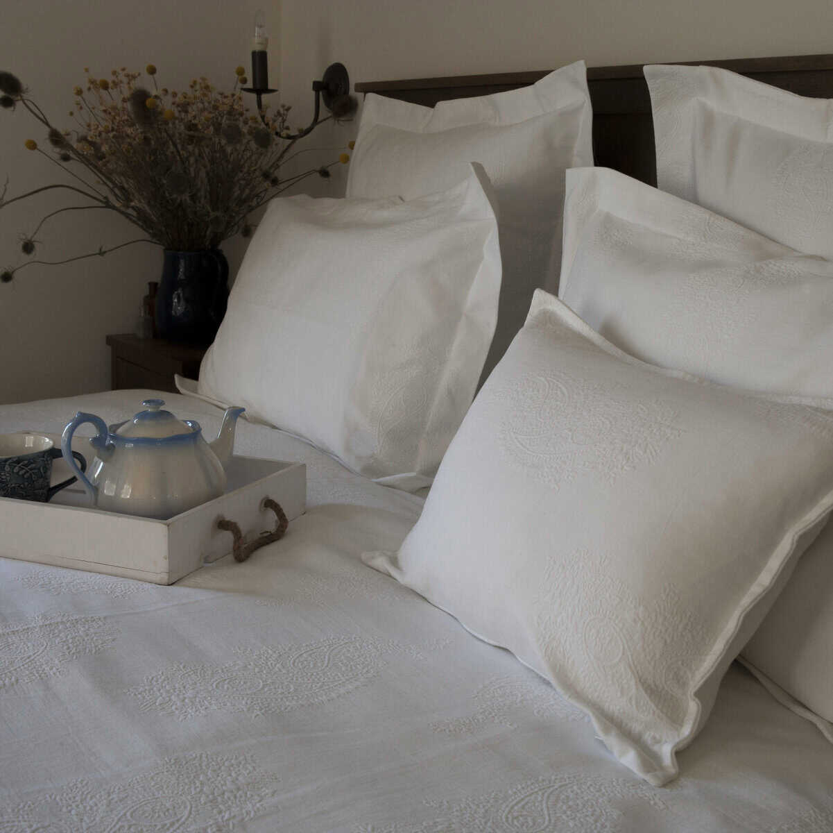 A bed with a Duvet Cover Set from The Ottoman Collection