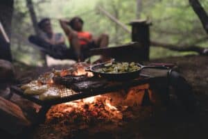 a meal cooking on a camp