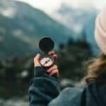 a compass for hiking on a mountain range