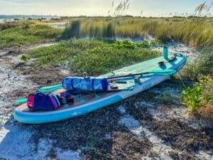 a paddle board with supplies on it
