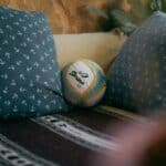 a couple of camping pillows on bed