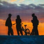 a group of mountain bikers socializing