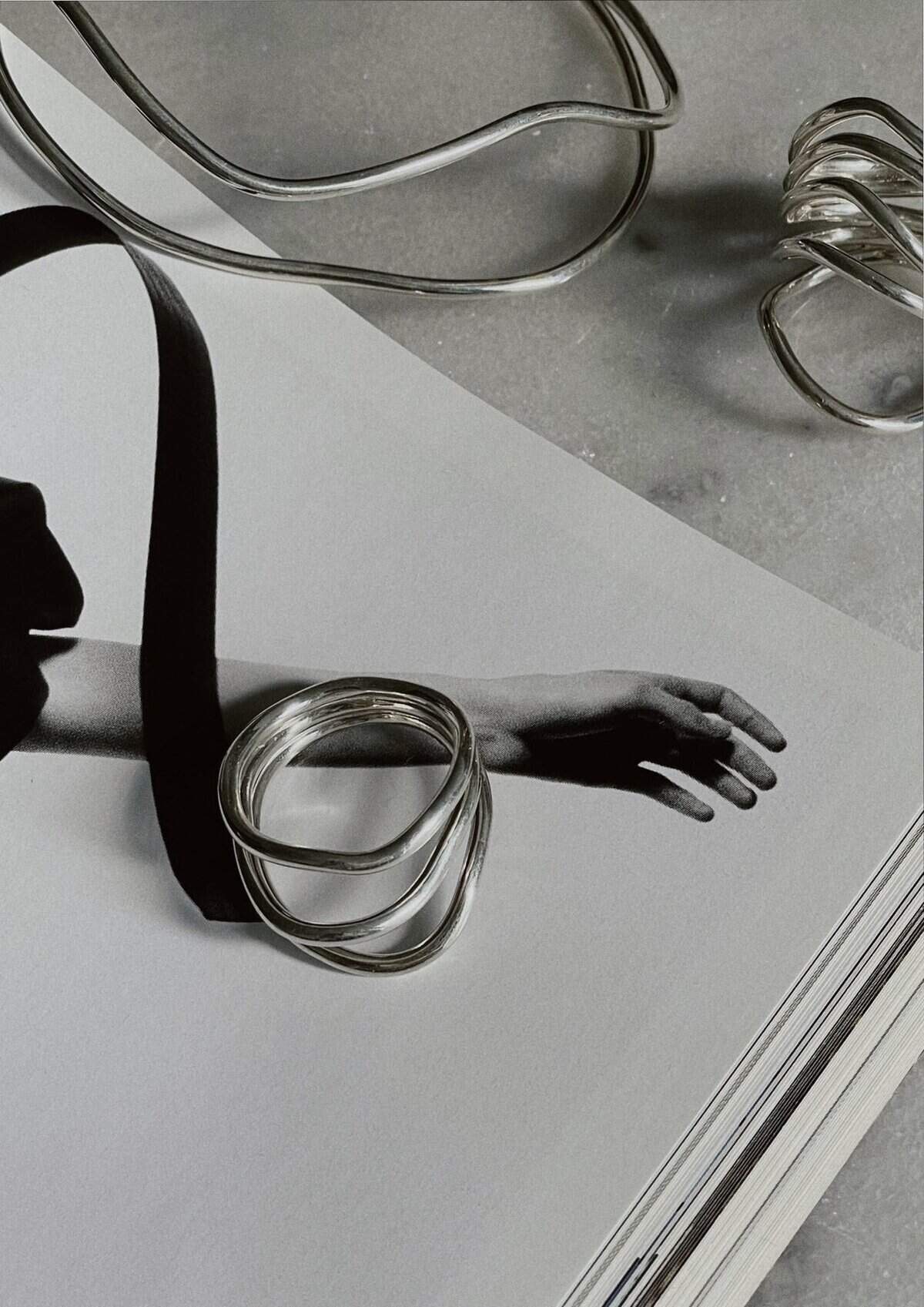 Elegant silver wave ring jewelry with flowing design, perfect for stylish accessories.