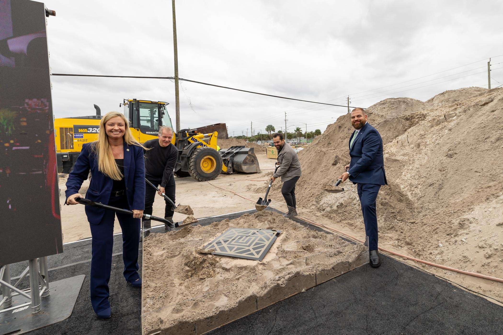Officials at a groundbreaking ceremony for a new infrastructure project.