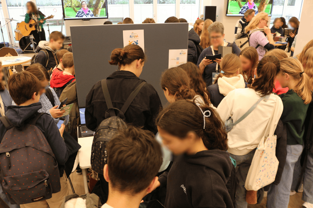 Group of people queueing to receive hand-knit anti-stress balls at BioBeo Festival