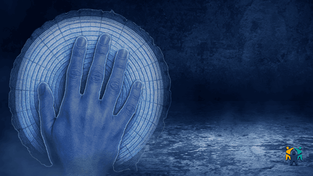 A symbolic blue-toned image of a hand on a glowing tree trunk, representing the growth and transmission of parenting skills across generations.