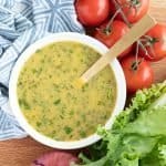 Mediterranean Herb Vinaigrette in a bowl with a spoon.