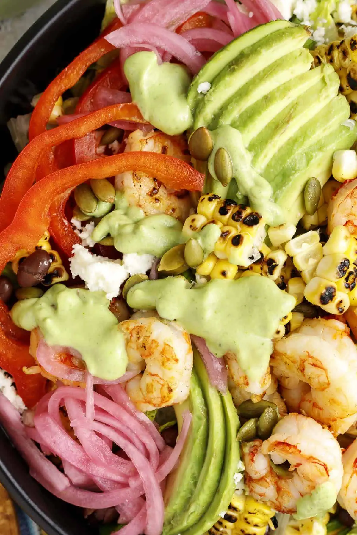 Avocado dressing is used atop a shrimp and avocado salad