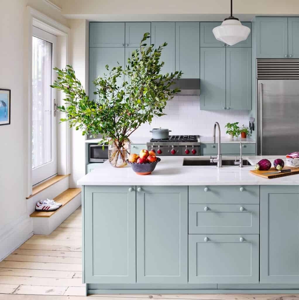 modern kitchen with teal painted cabinets