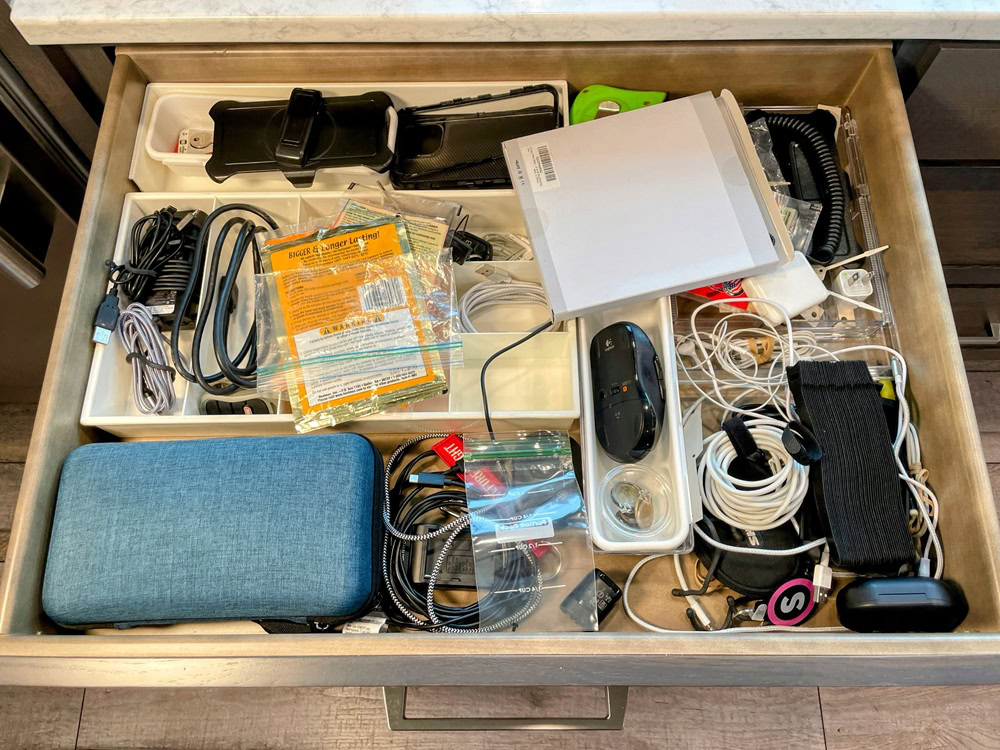 a messy tech drawer