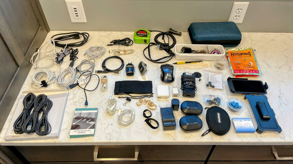 a bunch of tech drawer stuff laid out on a countertop