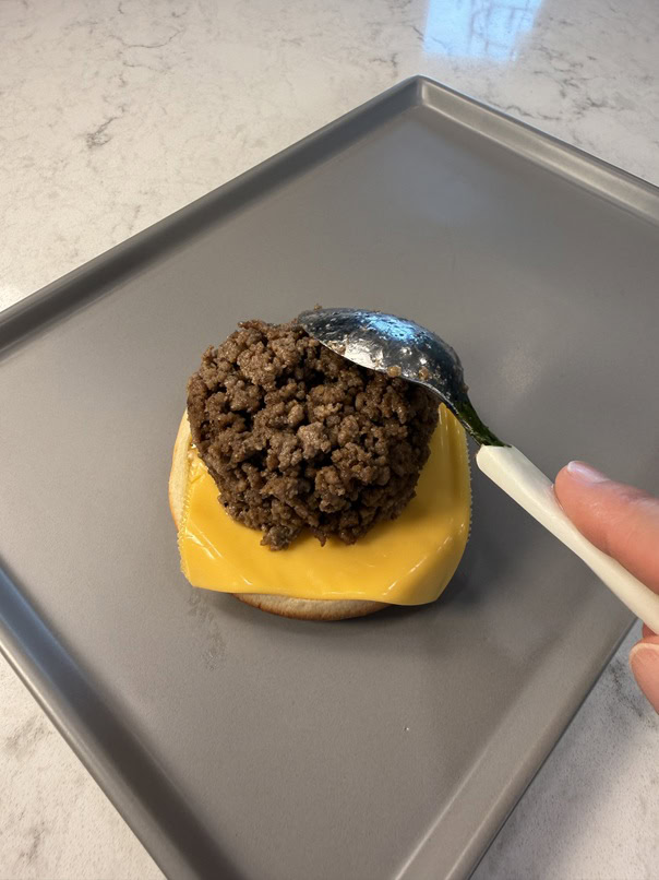 portioning meat onto bun