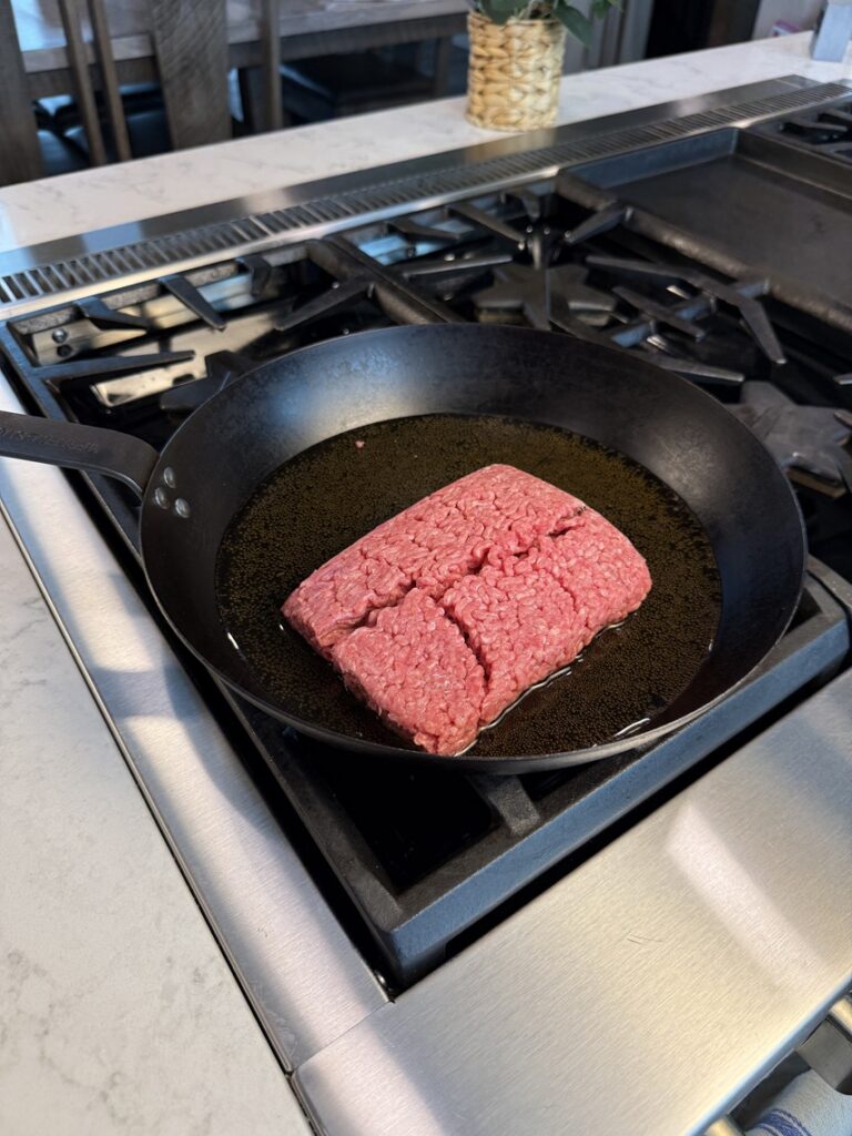 hamburger and beer in a skillet