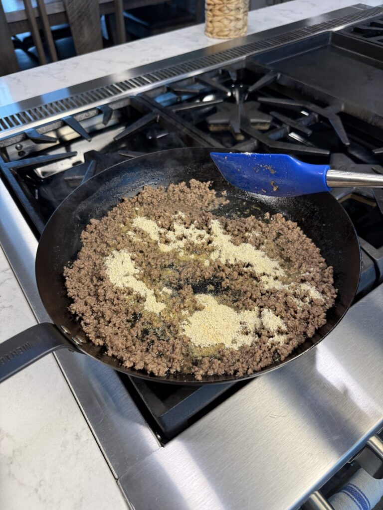adding seasonings to meat