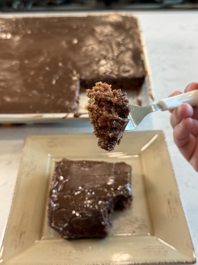 fork with a bite of chocolate cinnamon sheet cake