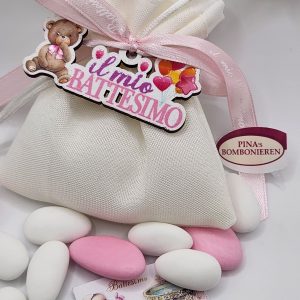A bag filled with white and pink candy.