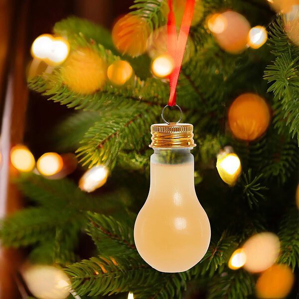 Energy-efficient 2oz clear plastic light bulb bottle for juice, perfect for holiday decorations.