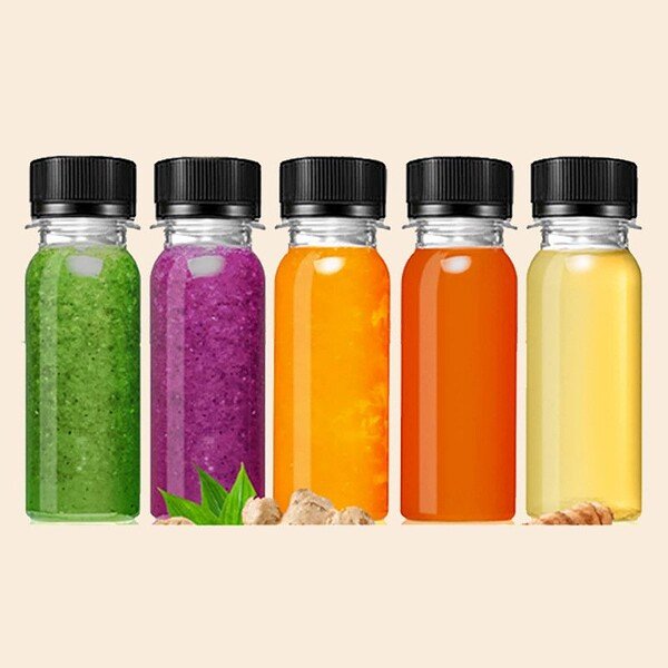 PET 2oz juice shot bottle with plastic cap for storing juice and beverages.