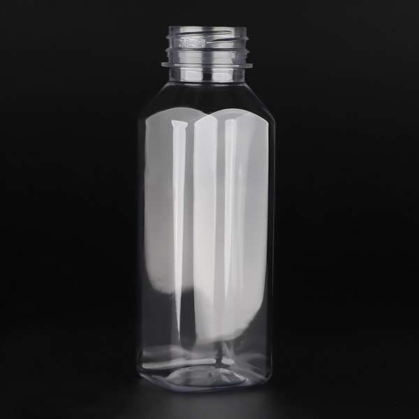 A 350ml (12oz) square juice bottle featuring a crystal-clear PET body; it is visually striking and allows for custom labeling.