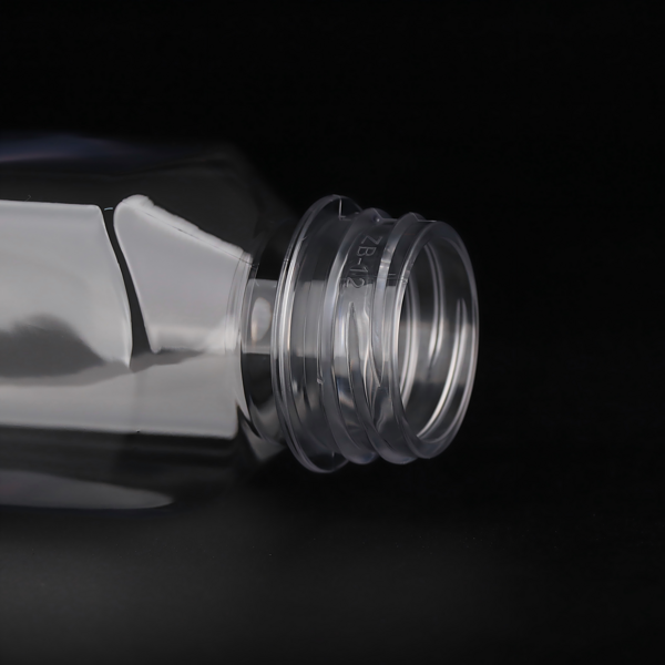 The neck of this 350 ml (12 oz) square clear empty juice bottle