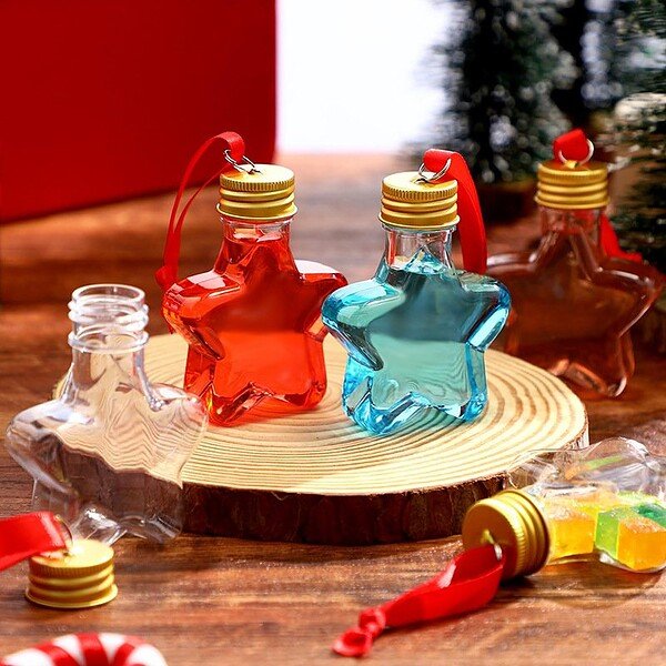 Colorful star-shaped plastic bottles for juice, perfect for Christmas gifts.
