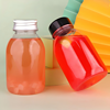 Bulk purchase of 250ml (8oz) round, clear, empty juice bottles, equipped with tamper-evident caps.