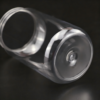 Clear plastic cans with aluminum easy-open lid for beverages or products.