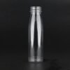 Clear plastic PET bottle for juice or beverage packaging.