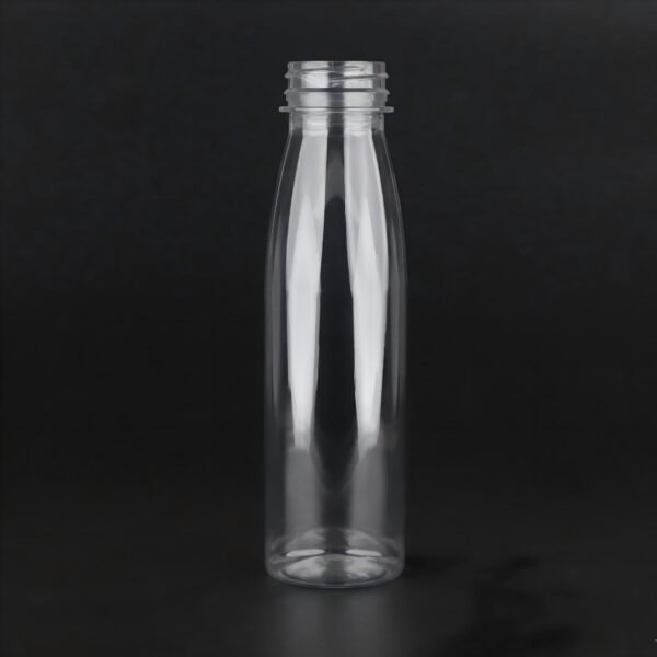 Clear plastic PET bottle for juice or beverage packaging.