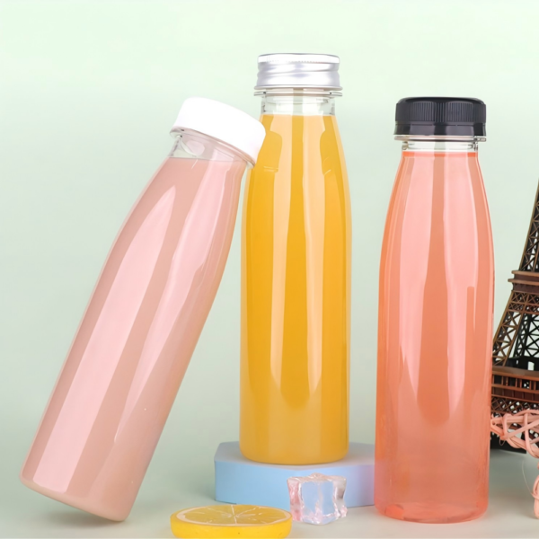 Assorted plastic bottles for beverages on pastel background.