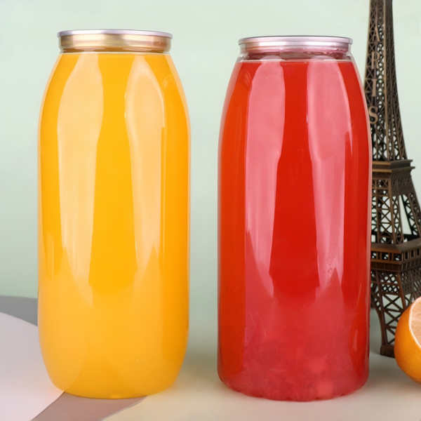 Colorful large glass jars with metal lids on a table.