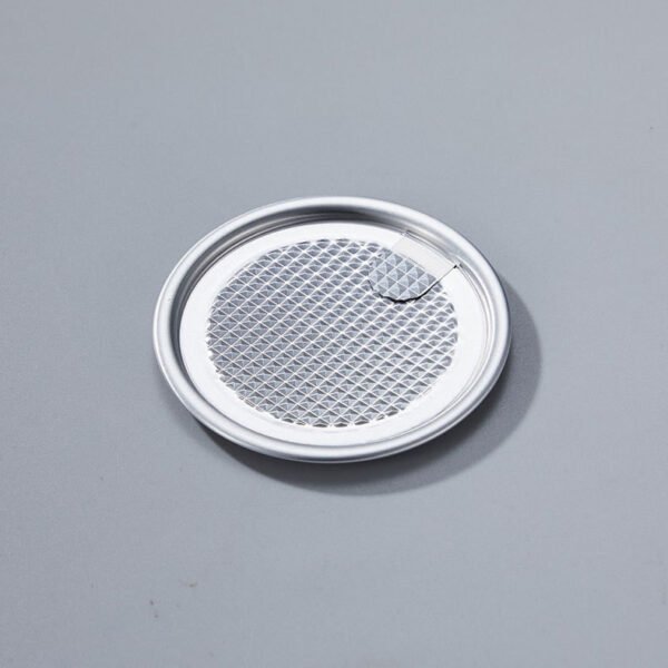 Round metal can lid with easy open tab for soda bottles.