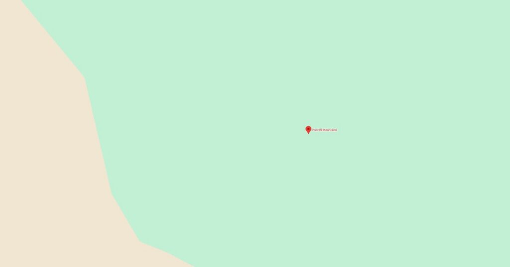 Serene mountain lake nestled in lush green forest, reflecting the sky and trees, perfect for nature lovers and outdoor adventures.