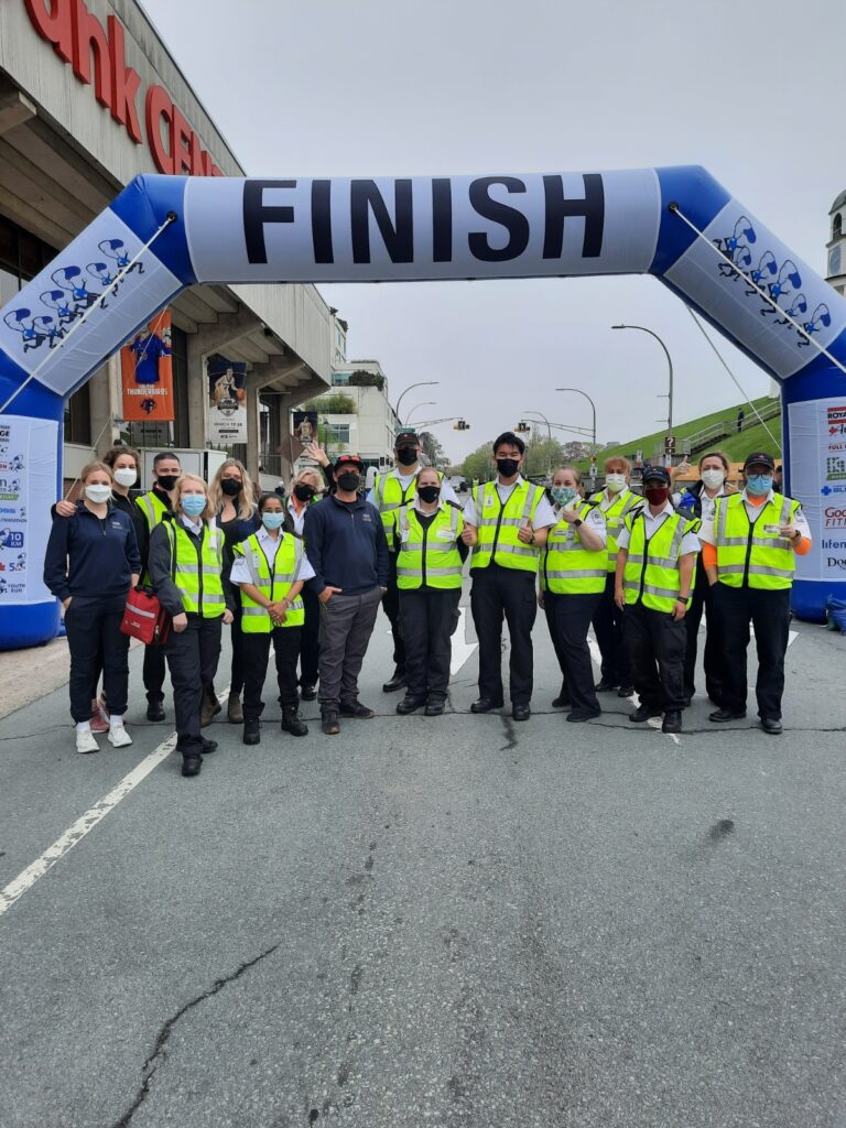PRAXES paramedics supporting the Blue Nose Marathon, gathered for a group photo at the race finish line in Halifax