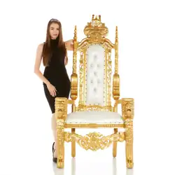 Gold throne with intricate details for weddings and parties.