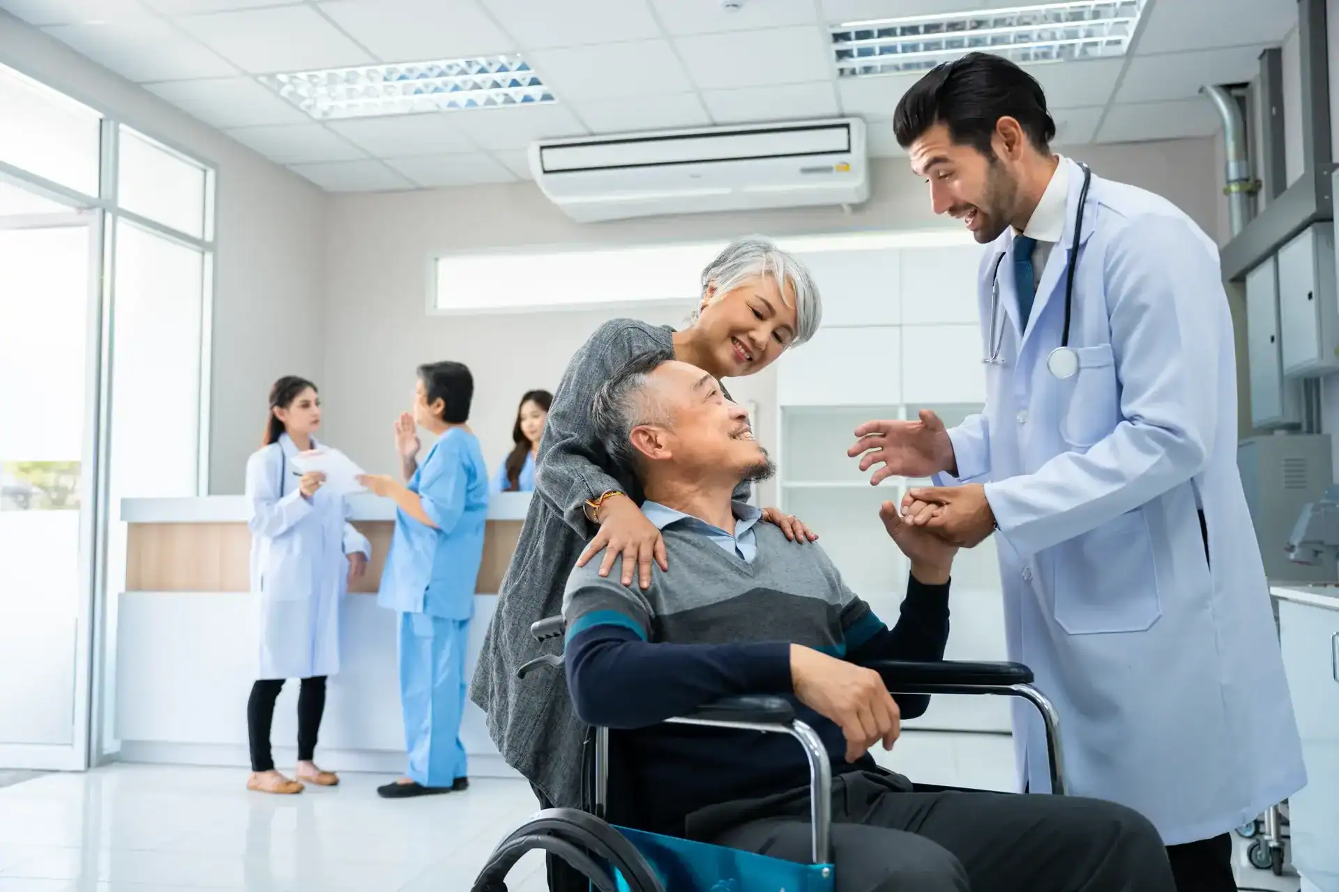 Healthcare professional engaging with a patient in a hospital setting.