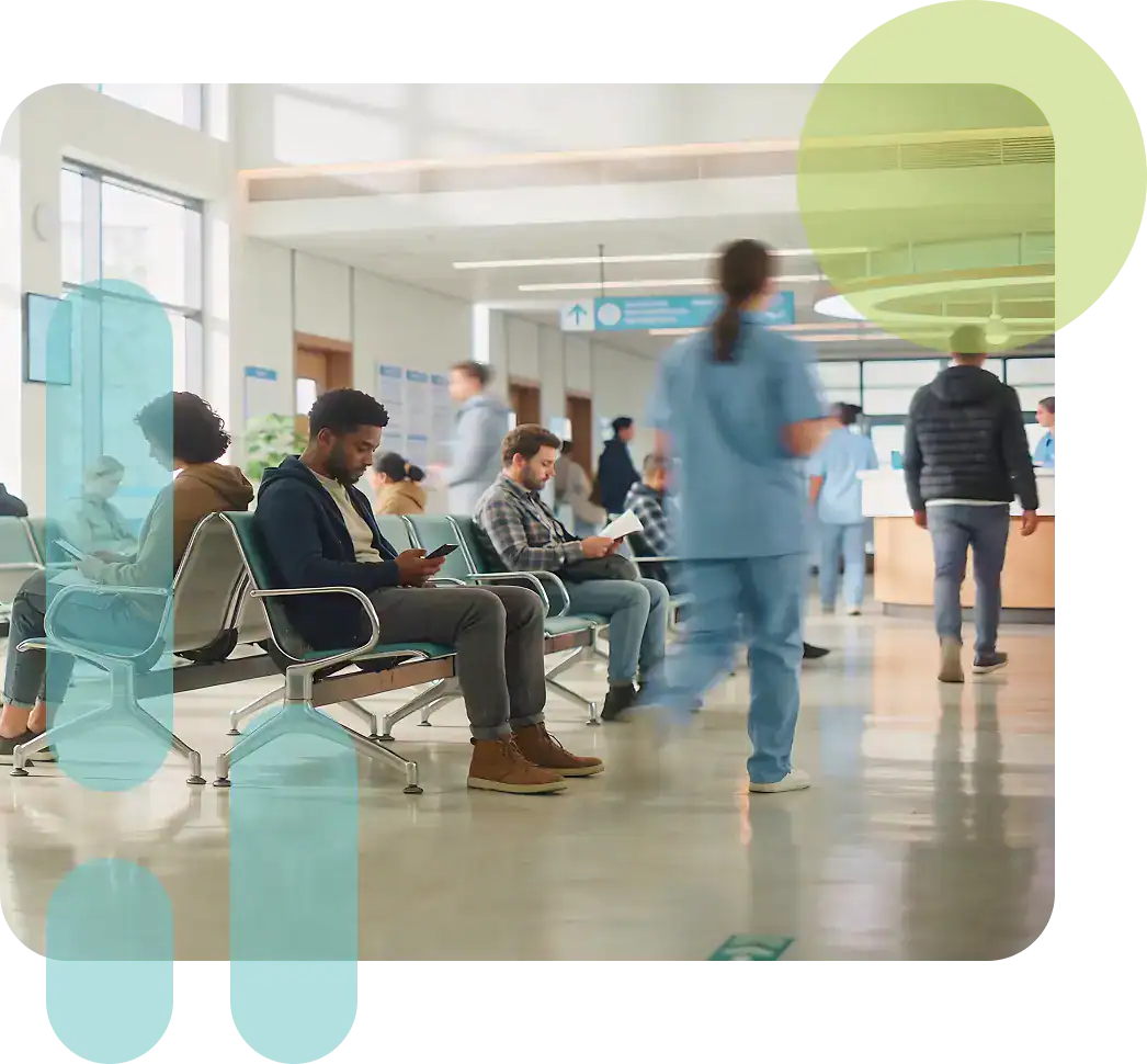 Patients waiting in a modern healthcare clinic with medical staff and seating.