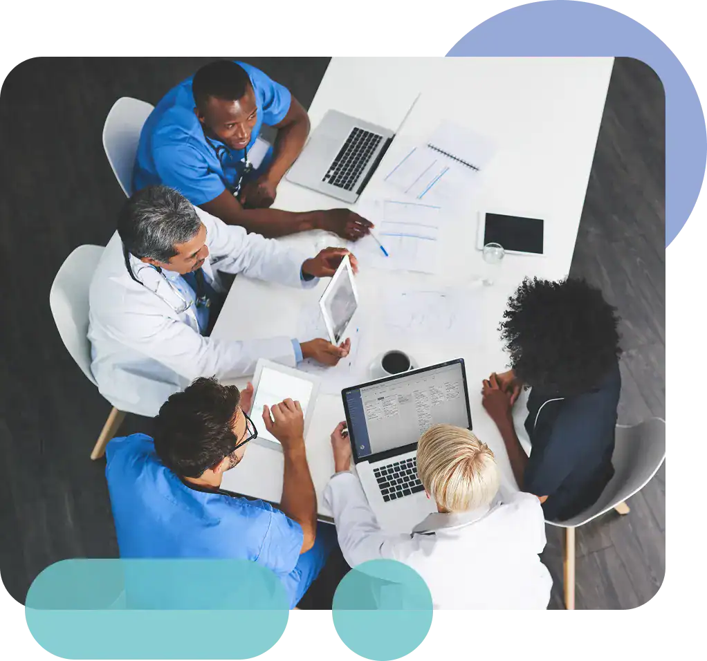Healthcare professionals collaborating in a medical team meeting at Proficient Health.