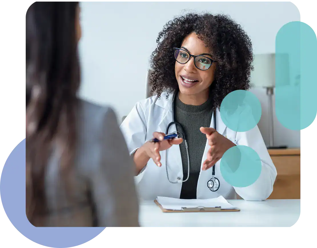 Doctor discussing health plan with patient in a clinic setting.