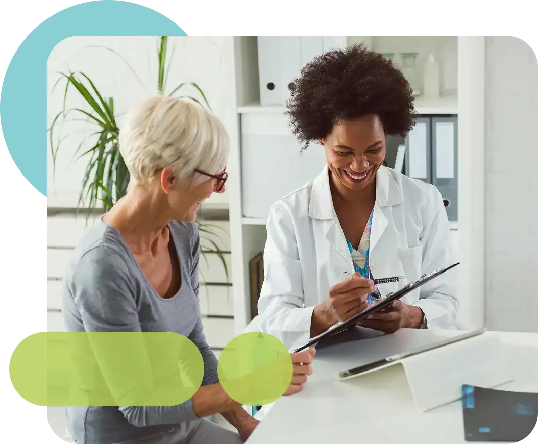 Healthcare professionals discussing patient care in a modern clinic setting.