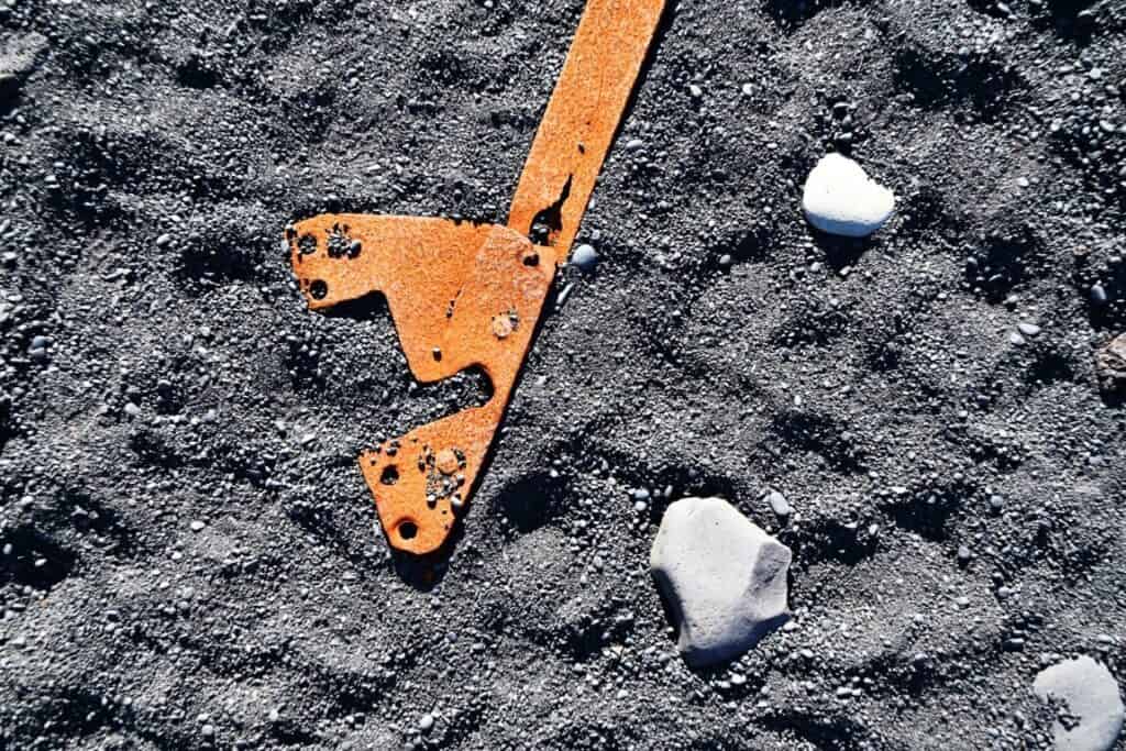 Iceberg fragment on volcanic sand, Snæfellsnes Peninsula, Iceland.