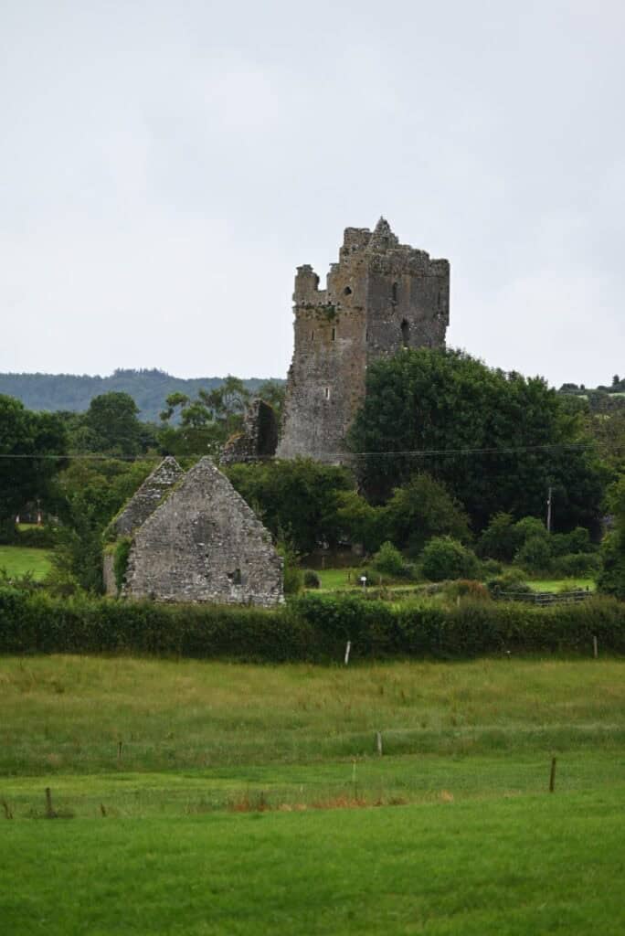 Ruins of a historic Irish castle overlooking lush green landscape in Cashel.