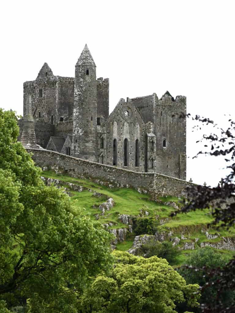 Ancient Irish castle ruins overlooking lush green landscape in Cashel, Ireland.