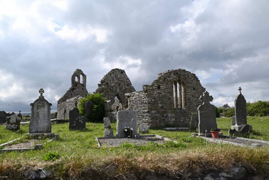 Ancient stone ruins and gravestones at Copper Coast, Cork, showcasing Ireland's rich history and sce.