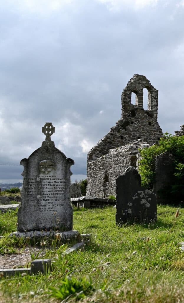 Ruins of old stone structures on the Irish Copper Coast, showcasing historic architecture and scenic.
