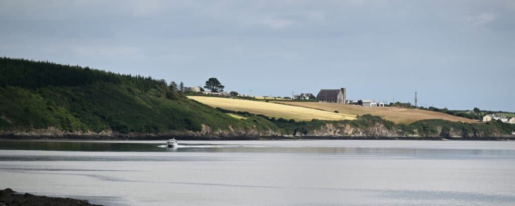 Coastal view of the Irish Copper Coast with cliffs and sea in County Cork, Ireland.