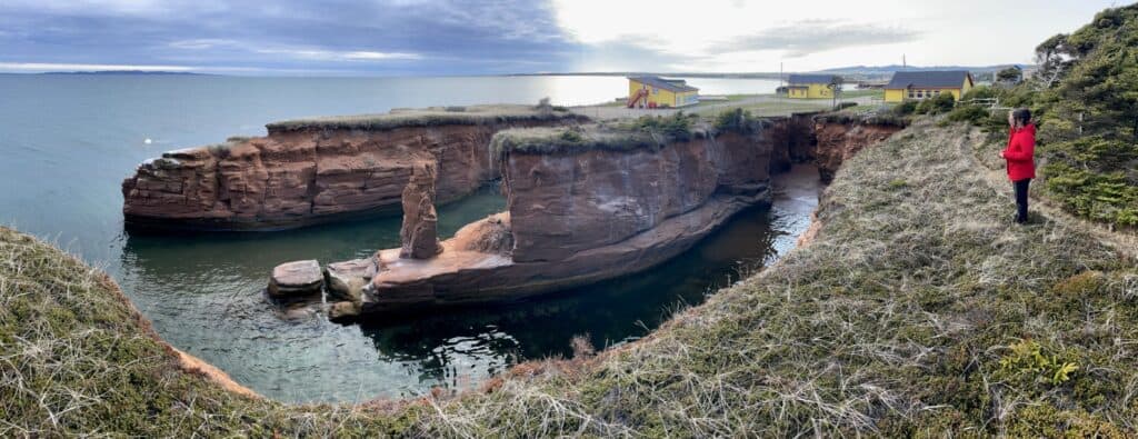 Îles-de-la-Madeleine coastal cliffs in May, showcasing rugged rock formations and scenic ocean views.