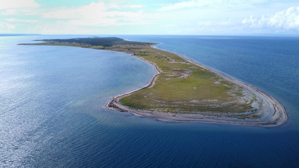 Aerial view of Sandy Point, showcasing its scenic shoreline and natural beauty.