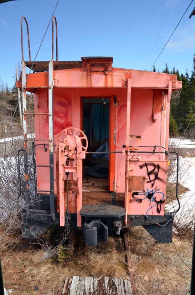 Old pink train car used for scenic railway experiences in Trinity Loop, BC.