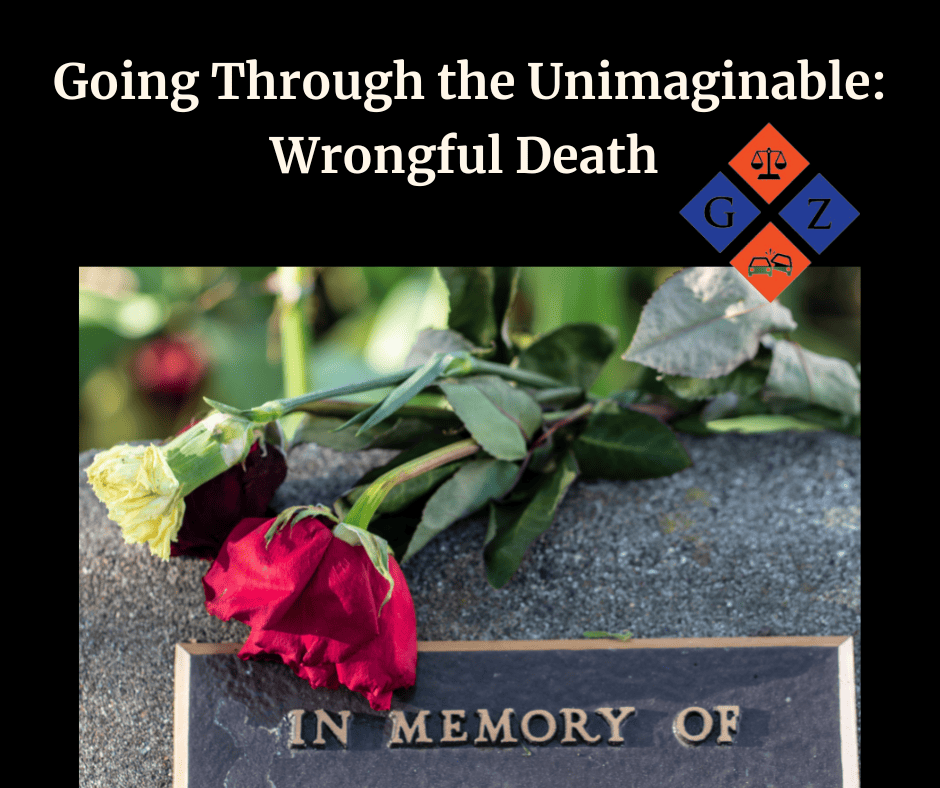 Roses laying on a memorial plaque for wrongful death victims, representing grief and remembrance.